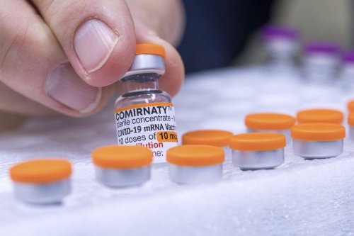 FILE - An ampoule of the vaccine 