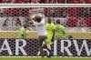 A protester runs on the pitch during the Club World Cup group G soccer match between Manchester City and Wydad AC in Philadelphia, Wednesday, June 18, 2025. (AP Photo/Derik Hamilton)