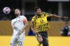 Borussia Dortmund's Jobe Bellingham and Monterrey's Sergio Ramos battle during the Club World Cup round of 16 soccer match between Borussia Dortmund and CF Monterrey in Atlanta, Tuesday, July 1, 2025. (AP Photo/Brynn Anderson)