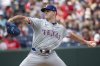 FILE - Texas Rangers starting pitcher Cody Bradford delivers against the Cleveland Guardians during the first inning of a baseball game in Cleveland on Aug. 25, 2024. (AP Photo/Phil Long, File)