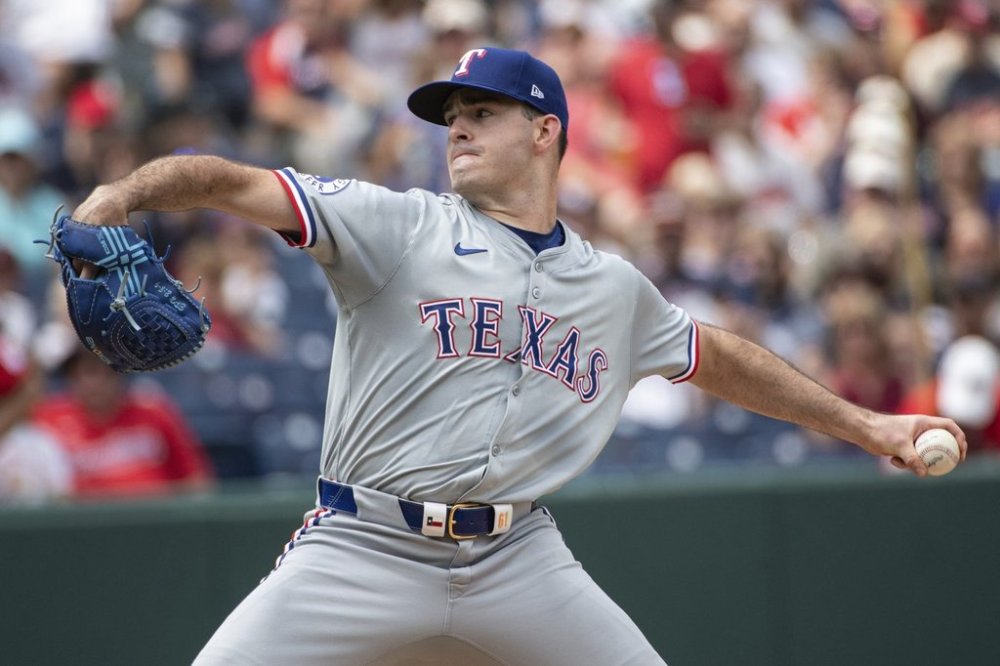 FILE - Texas Rangers starting pitcher Cody Bradford delivers against the Cleveland Guardians during the first inning of a baseball game in Cleveland on Aug. 25, 2024. (AP Photo/Phil Long, File)