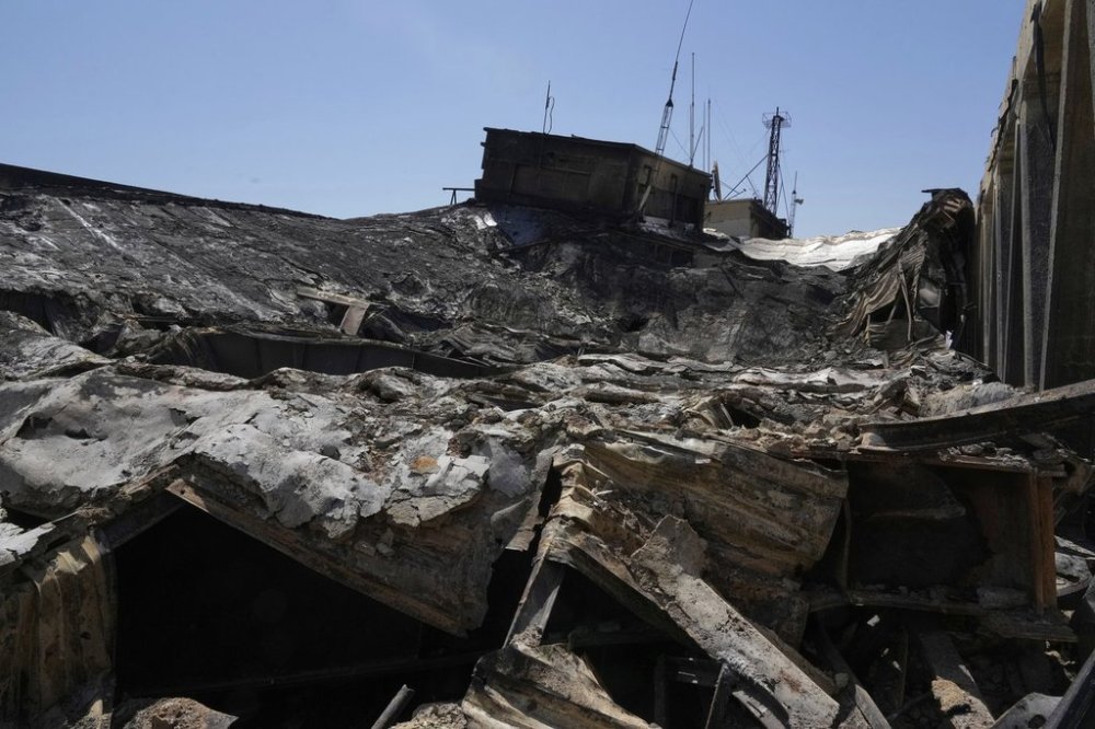 The damaged headquarters of Islamic Republic of Iran Broadcasting, Iranian state television, in Tehran, Iran, Thursday, June 19, 2025. (AP Photo/Vahid Salemi)