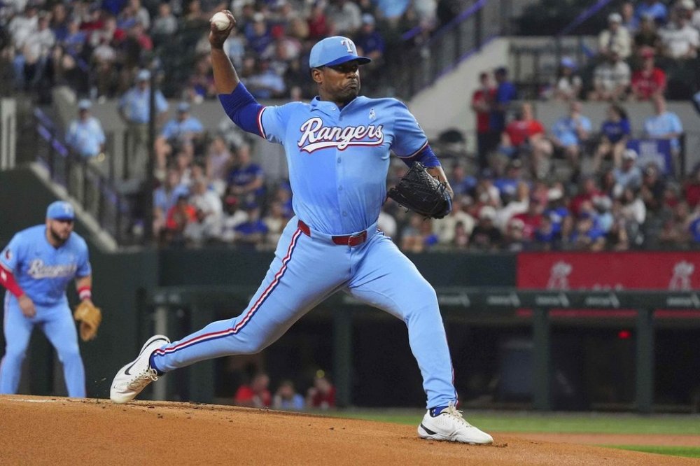 Texas Rangers starting pitcher Kumar Rocker throws during the first inning of a baseball game against the Chicago White Sox, Sunday, June 15, 2025, in Arlington, Texas. (AP Photo/LM Otero)
