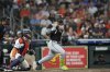 Chicago White Sox's Edgar Quero (7) hits a two-run single as Houston Astros catcher Victor Caratini watches during the third inning of a baseball game Tuesday, June 10, 2025, in Houston. (AP Photo/David J. Phillip)