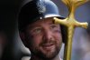 Seattle Mariners' Cal Raleigh holds the 