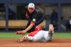 Los Angeles Angels' Jo Adell (7) slides safely into second base with a double ahead of the tag from Toronto Blue Jays second baseman Andres Gimenez in fifth inning MLB baseball action in Toronto on Friday, July 4, 2025. THE CANADIAN PRESS/Jon Blacker