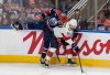 Florida Panthers forward Evan Rodrigues (17) checks Oilers centre Connor McDavid (97) during the third period in Game 2 of the NHL Stanley Cup final in Edmonton on Friday, June 6, 2025. THE CANADIAN PRESS/Jason Franson