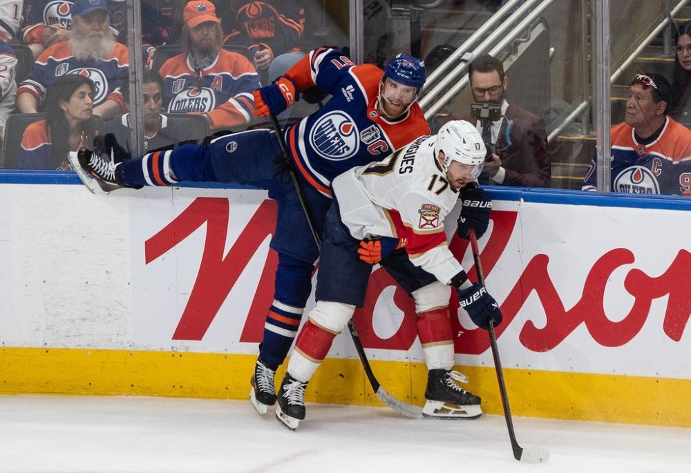 Florida Panthers forward Evan Rodrigues (17) checks Oilers centre Connor McDavid (97) during the third period in Game 2 of the NHL Stanley Cup final in Edmonton on Friday, June 6, 2025. THE CANADIAN PRESS/Jason Franson