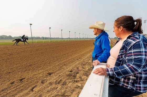 Ciera Pruitt gallops past her parents, Jerry and Lise. (Mike Deal / Free Press)