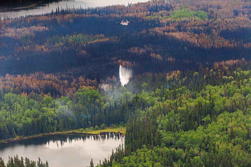 Tour of the wildfire conditions around Flin Flon by helicopter.