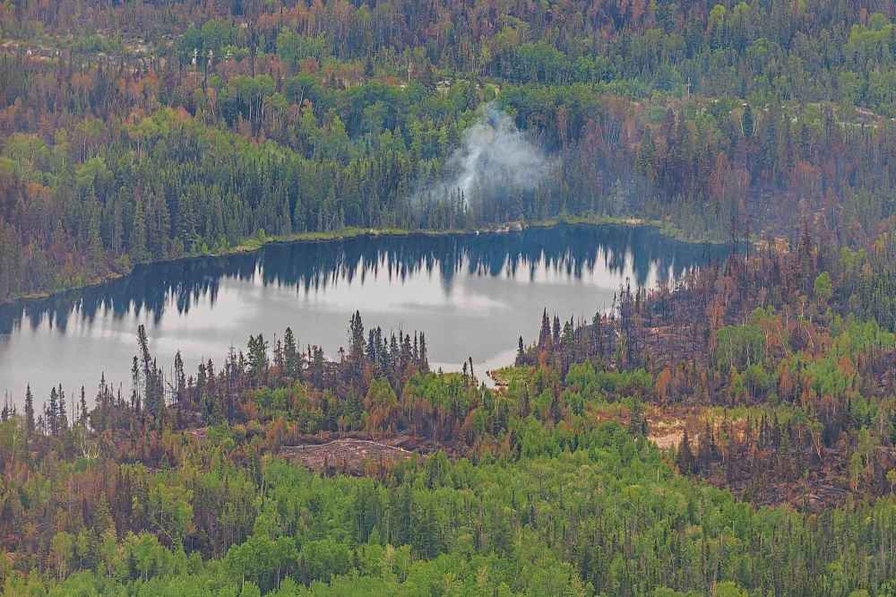 Tour of the wildfire conditions around Flin Flon by helicopter.