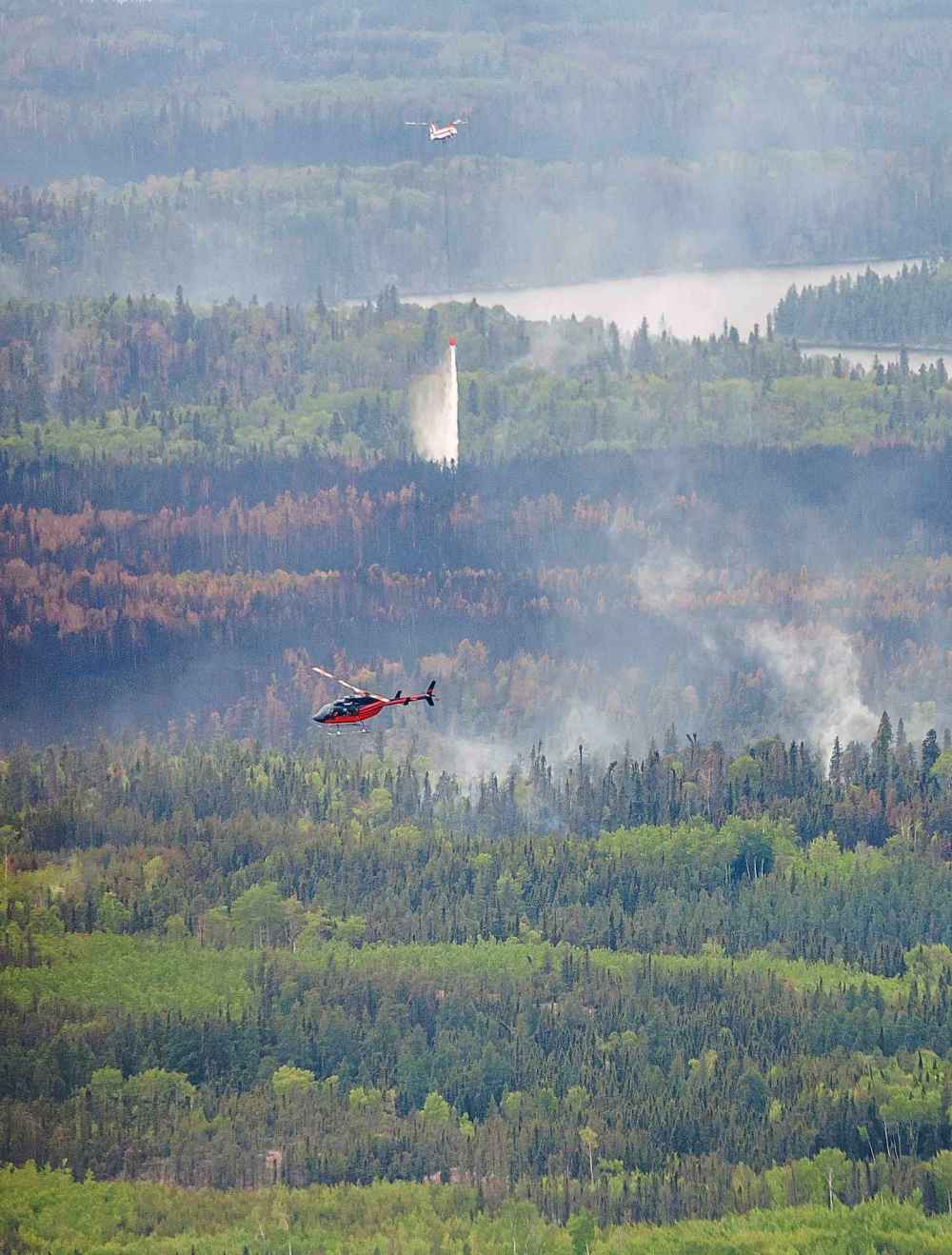 Tour of the wildfire conditions around Flin Flon by helicopter.