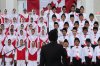 Children sing the Canadian national anthem at the Baitul Islam Mosque in Vaughan, Ont., during Canada Day festivities on Friday July 1, 2016. THE CANADIAN PRESS/Cole Burston