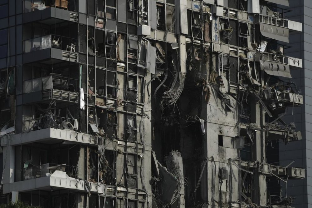 A residential building that was struck by a missile fired from Iran, is seen in Tel Aviv, Israel, on Saturday, June 14, 2025. (AP Photo/Leo Correa)