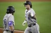 Colorado Rockies' Michael Toglia, right, celebrates his home run with Sam Hilliard, left, during the seventh inning of a baseball game against the Washington Nationals, Tuesday, June 17, 2025, in Washington. (AP Photo/Nick Wass)