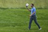 Victor Perez, of France, tips his cap as he walks up to the seventh tee after making a hole in one on the sixth hole during the second round of the U.S. Open golf tournament at Oakmont Country Club Friday, June 13, 2025, in Oakmont, Pa. (AP Photo/Seth Wenig)