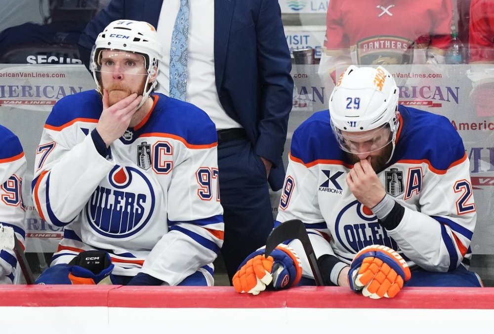 Edmonton Oilers captain Connor McDavid (97) and centre Leon Draisaitl (29) react to a Florida Panthers empty-net goal during the third period in Game 6 of the Stanley Cup final in Sunrise, Fla., on Tuesday, June 17, 2025. THE CANADIAN PRESS/Nathan Denette