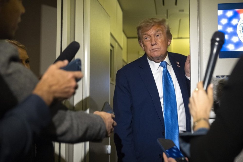President Donald Trump speaks with reporters while flying aboard Air Force One en route from Calgary, Canada to Joint Base Andrews, Md., late Monday, June 16, 2025. (AP Photo/Mark Schiefelbein)