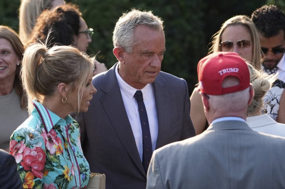 Health and Human Services Secretary Robert F. Kennedy Jr. and his wife Cheryl Hines talk to guests before President Donald Trump speaks during a summer soiree on the South Lawn of the White House, Wednesday, June 4, 2025, in Washington. (AP Photo/Alex Brandon)