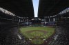 FILE - The roof to Chase Field begins to open prior to an opening-day baseball game between the Arizona Diamondbacks and the Chicago Cubs Thursday, March 27, 2025, in Phoenix. (AP Photo/Ross D. Franklin,File)