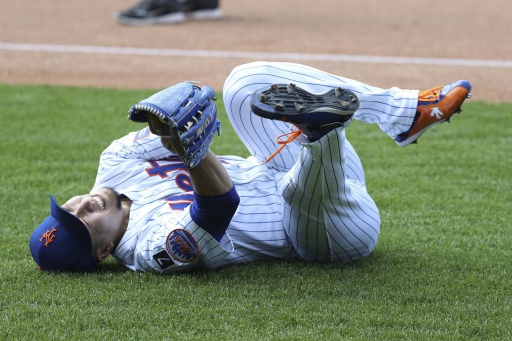 New York Mets pitcher Kodai Senga reacts after an apparent injury during the sixth inning of a baseball game against the Washington Nationals, Thursday, June 12, 2025, in New York. (AP Photo/Pamela Smith)