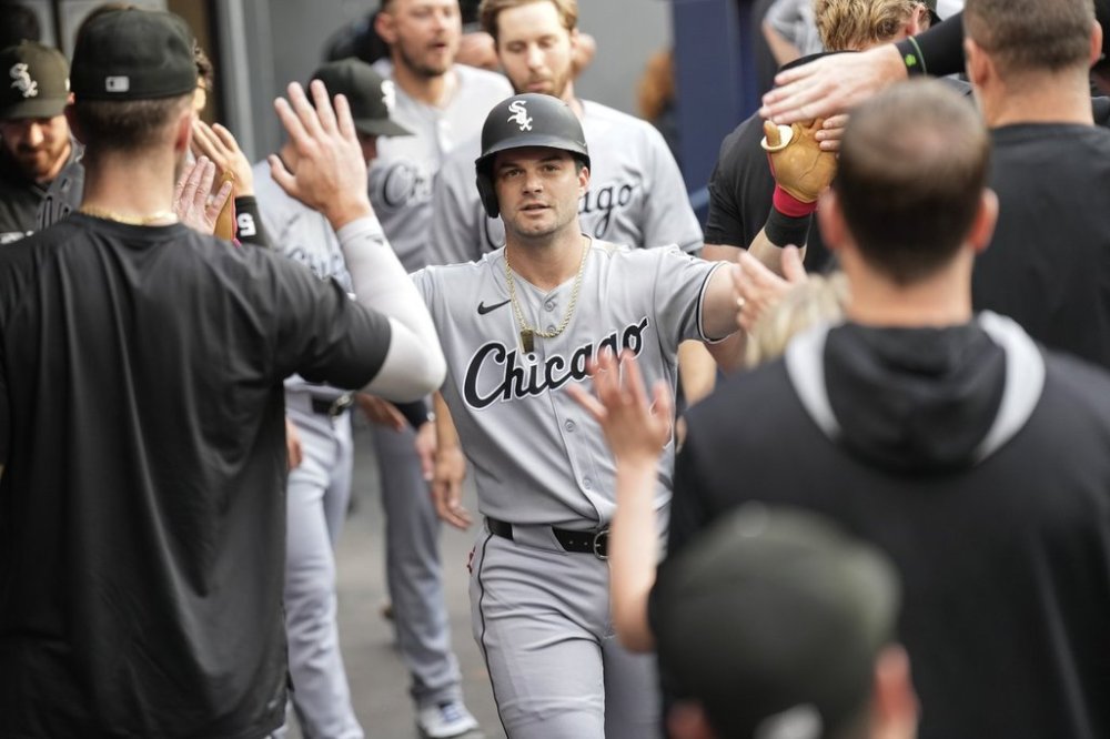 Chicago White Sox's Andrew Benintendi (23) celebrates in the dug out after hitting a solo home run off Toronto Blue Jays pitcher Spencer Turnbull during first inning MLB baseball action in Toronto on Friday June 20, 2025. THE CANADIAN PRESS/Chris Young