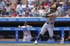 Milwaukee Brewers' Sal Frelick (10) hits a single off of Minnesota Twins pitcher Simeon Woods Richardson during the first inning of a baseball game, Saturday, June 21, 2025, in Minneapolis. (AP Photo/Bailey Hillesheim)