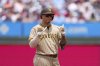 San Diego Padres' Manny Machado reacts after hitting a three-run double against Philadelphia Phillies pitcher Mick Abel during the second inning in the first baseball game of a doubleheader Wednesday, July 2, 2025, in Philadelphia. (AP Photo/Matt Slocum)