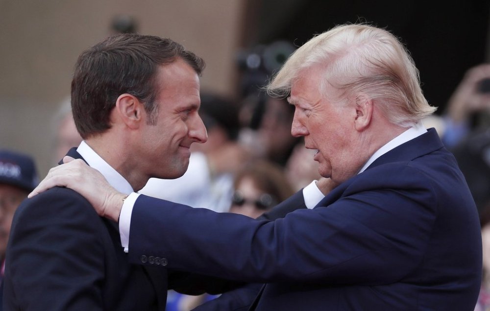 FILE - French President Emmanuel Macron, left, meets U.S President Donald Trump during a ceremony to mark the 75th anniversary of D-Day at the Normandy American Cemetery in Colleville-sur-Mer, Normandy, France, on June 6, 2019. (Ian Langsdon/Pool via AP, File)