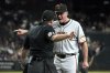 San Francisco Giants manager Bob Melvin has words with home plate umpire Quinn Wolcott (81) after getting ejected from the game in the ninth inning during a baseball game against the Arizona Diamondbacks, Monday, June 30, 2025, in Phoenix. (AP Photo/Rick Scuteri)