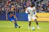 Toronto FC defender Zane Monlouis (12) looks for an open teammate during the first half of an MLS soccer match against FC Cincinnati, Saturday, March 8, 2025, in Cincinnati. (AP Photo/Tanner Pearson)