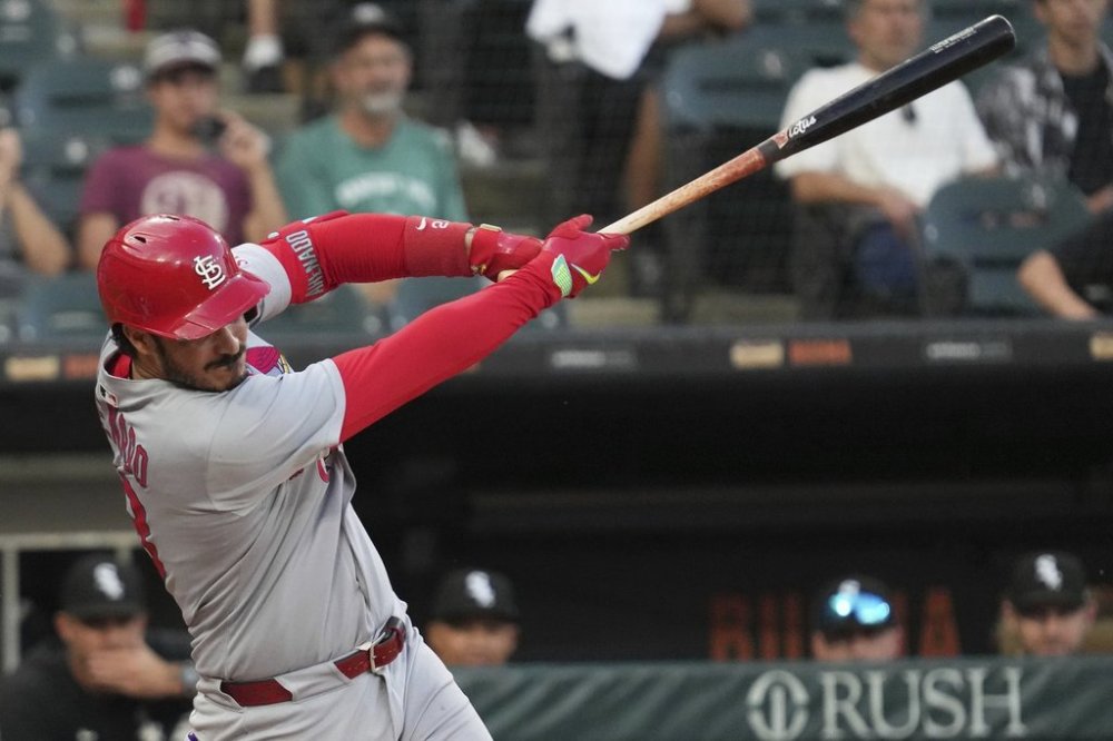 St. Louis Cardinals' Nolan Arenado hits a one-run single during the 10th inning in the second baseball game of a doubleheader against the Chicago White Sox, Thursday, June 19, 2025. (AP Photo/Nam Y. Huh)