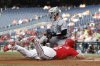 Washington Nationals' Luis García Jr. (2) slides into home plate and beats the tag from Detroit Tigers catcher Dillon Dingler and scores a run on a ball hit by Josh Bell against pitcher Jack Flaherty during the first inning in the second baseball game of a doubleheader in Washington, Wednesday, July 2, 2025. (AP Photo/Terrance Williams)