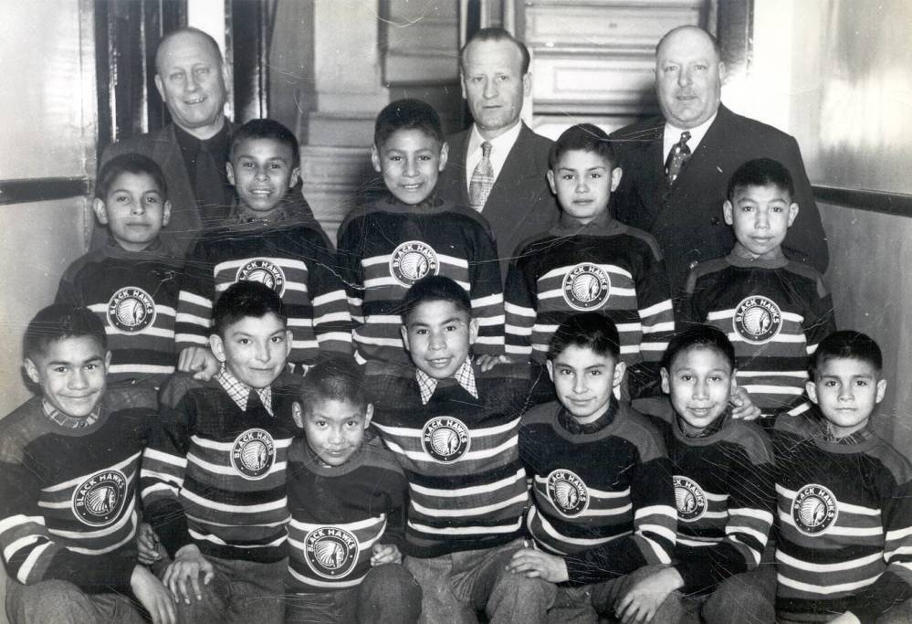 Western Archives and Special Collections, Western University
The Black Hawks (circa 1951-1952) with personnel, including (upper row, from left)
Indian Agent Gifford Swartman, local businessman and volunteer Oreste Tintinalli and local businessman and booster Art Schade. The players pictured in the middle row (from left) are Lawrence Carpenter, Albert Carpenter, Kelly Bull, Ernest Wesley and Agrippa Beardy, and in the front row (from left) are Frank Wesley, Chris Cromarty, Lawrence Beardy, David Wesley, Walter Kakepetum, Henry Spence and Angus Wesley.