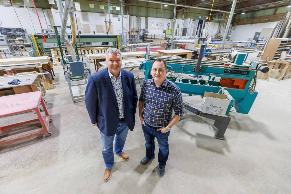 MIKE DEAL / FREE PRESS
FloForm Countertops president and CEO Ted Sherritt (left) and Curtis Lazaruk, vice-president manufacturing, on the floor of the Winnipeg company’s workshop at 101 Hamelin St.