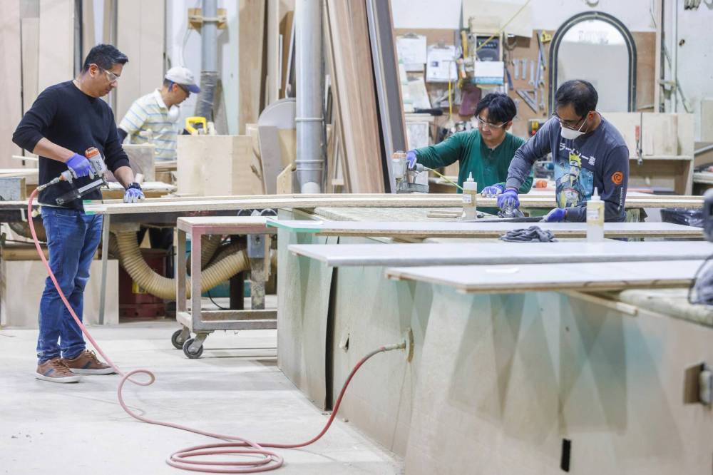 MIKE DEAL / FREE PRESS
Employees on the floor of the Floform workshop.
