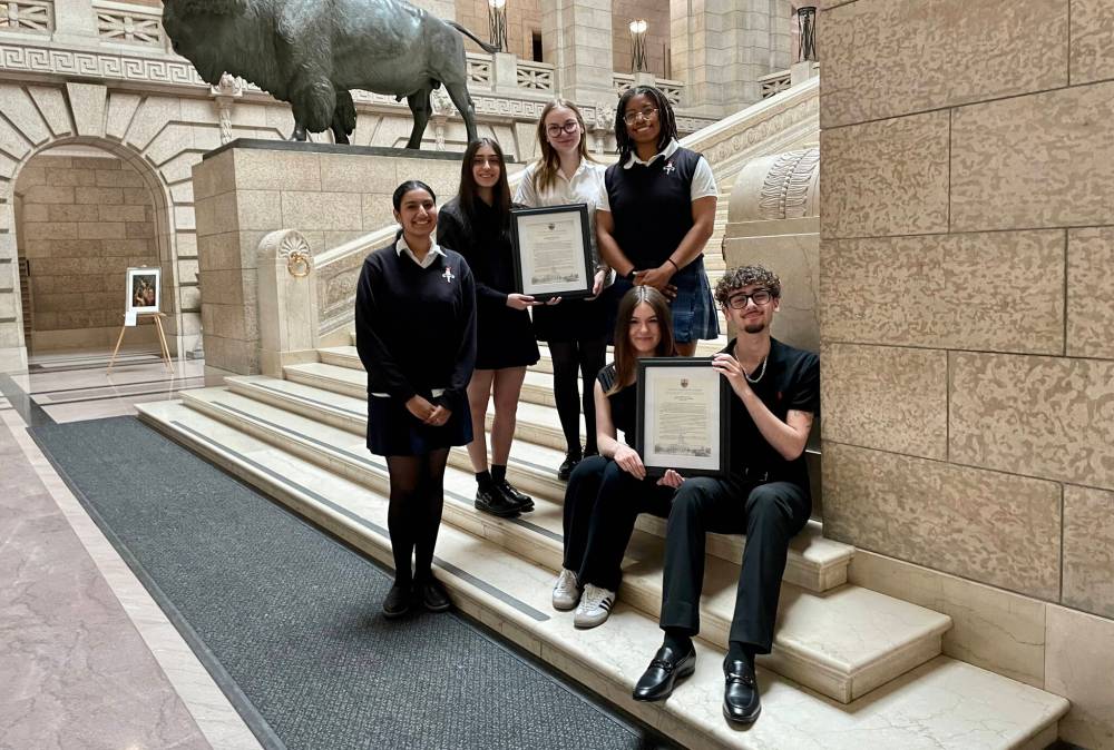 MAGGIE MACINTOSH / FREE PRESS
St. Mary’s Academy students (from left to right) Anureet Chaudhary, Diana Bonakdar, Nadia Lovallo and Chinanuokum Onyiuke and Kelvin High School’s Salina Lupu and Matias Lastra (both seated) met at the Manitoba legislature this week as part of the newly formed River Heights inter-school council.