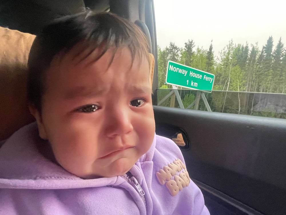 SUPPLIED
                                Greenly Osborne, eight months, gets emotional as her family makes the trip from Cross Lake to Norway House.