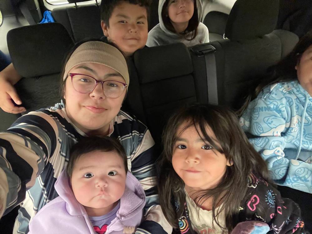 SUPPLIED
                                Lori Osborne and her family on a bus to Peguis First Nation after being evacuated from Cross Lake to Norway House where they were airlifted to Winnipeg and bussed to Peguis.