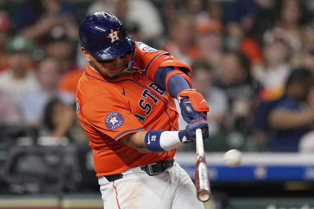 Houston Astros' Isaac Paredes hits a home run against the Chicago White Sox during the fifth inning of a baseball game Thursday, June 12, 2025, in Houston. (AP Photo/David J. Phillip)