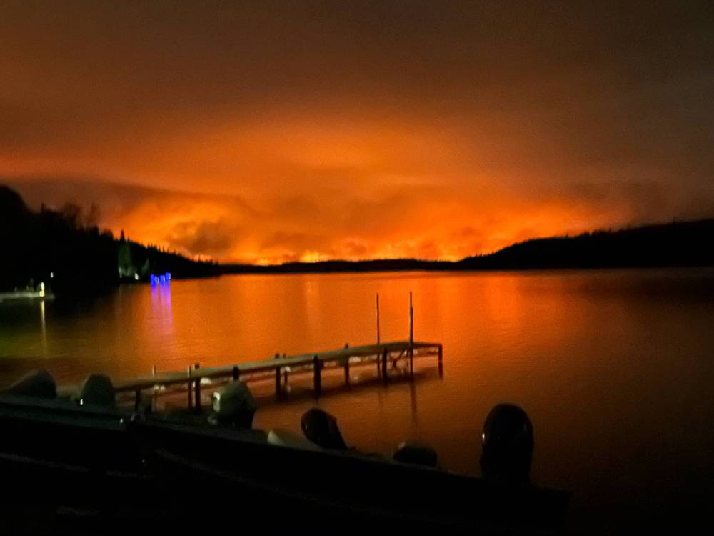 Kristina and Joe Lies, who live and run Westwood Lodge just southeast of Flin Flon, were forced to leave May 28 as flames moved closer to the community. About 5,000 residents were displaced by a blaze that is on the northern Manitoba city’s doorstep. (Supplied)
