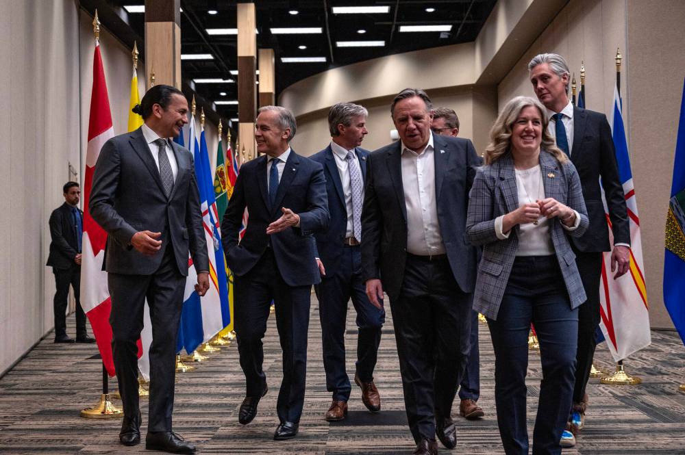 The Canadian Press Files
Manitoba Premier Wab Kinew, left, talks with Prime Minister Mark Carney during the First Minister’s Meeting in Saskatoon last Monday.