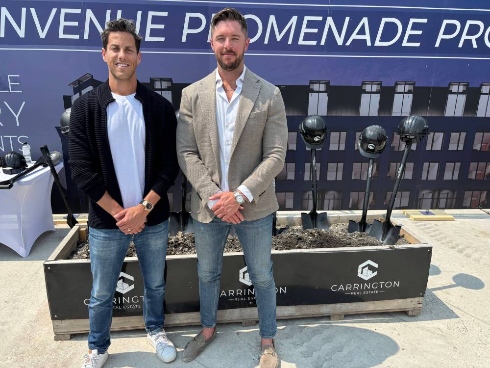 AARON EPP / FREE PRESS
Carrington Real Estate CEO Sam Goszer (left) and president Jared Carrington.