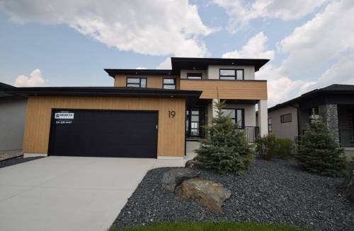 Todd Lewys photos / Free Press
                                Clad in durable metal woodgrain-style siding, 19 Oasis is a warm, inviting luxury home that’s all about function and elegant, understated style.
