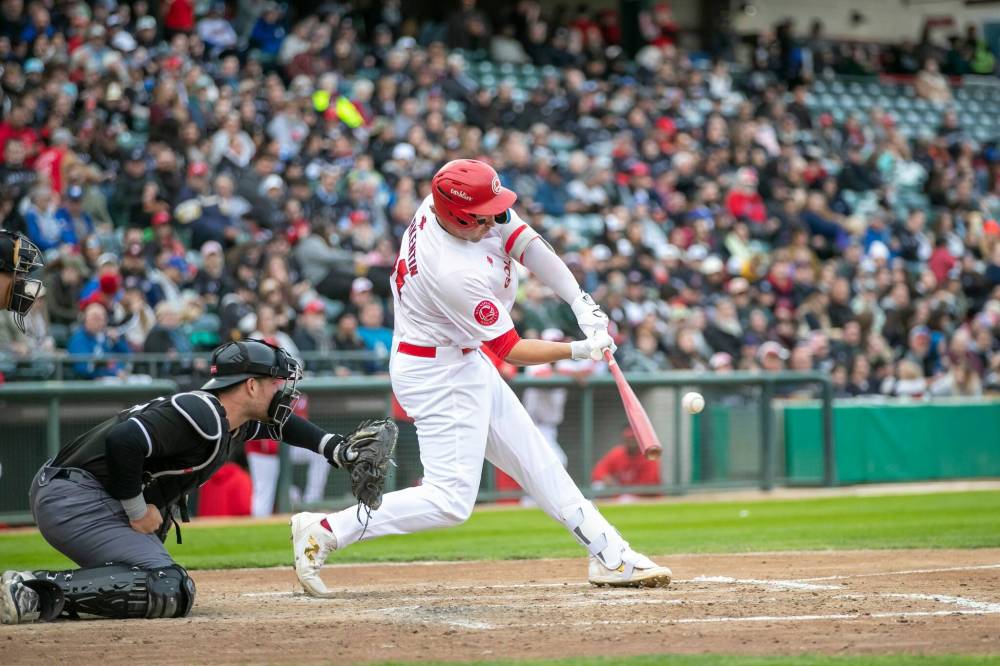 BROOK JONES / FREE PRESS FILES
Winnipeg Goldeyes infielder Matthew Warkentin connects with the ball. The Fish will host their first National Indigenous Peoples Day celebration game day on Saturday, with 400 free tickets going to wildfire evacuees.