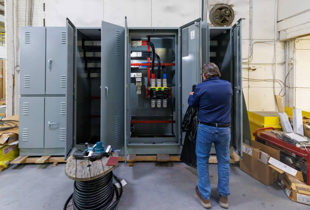 MIKE DEAL / FREE PRESS
Darrell Driedger, chief operating officer at Strong Electric, 906 King Edward Street, on the shop floor with a 2000amp breaker being assembled for an industrial building site. Strong Electric manufactures products for the electrical industry.