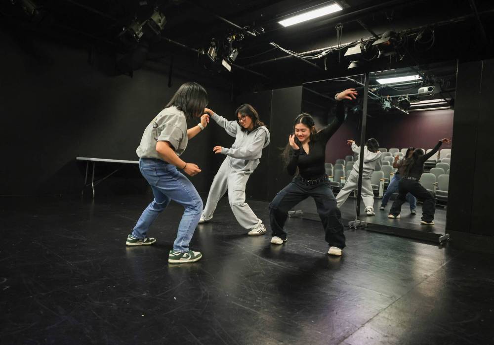 Ruth Bonneville / Free Press
From left: Choreographer Sharlyne Chua leads dancers Ephifany Tiongco and Gwyneth De Guzman through their steps during rehearsal for The Remix, a hip hop dance show featuring 70 dancers and multiple choreographers.