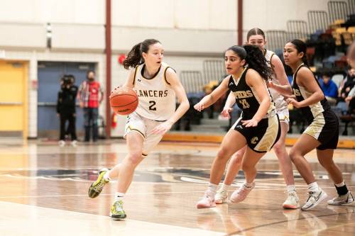 Dakota Lancers basketball guard Taylor Schepp (left) was one of four graduating student-athletes named recipients of the Manitoba High Schools Athletic Association’s Scholar Athlete of the Year on Thursday. (Mikaela MacKenzie / Free Press files)