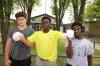 TIM SMITH / THE BRANDON SUN FILES
                                Chinonso Onuke is held by close friend Leland Henderson and his twin brother Chiemeka during his first visit back to the school on Friday.