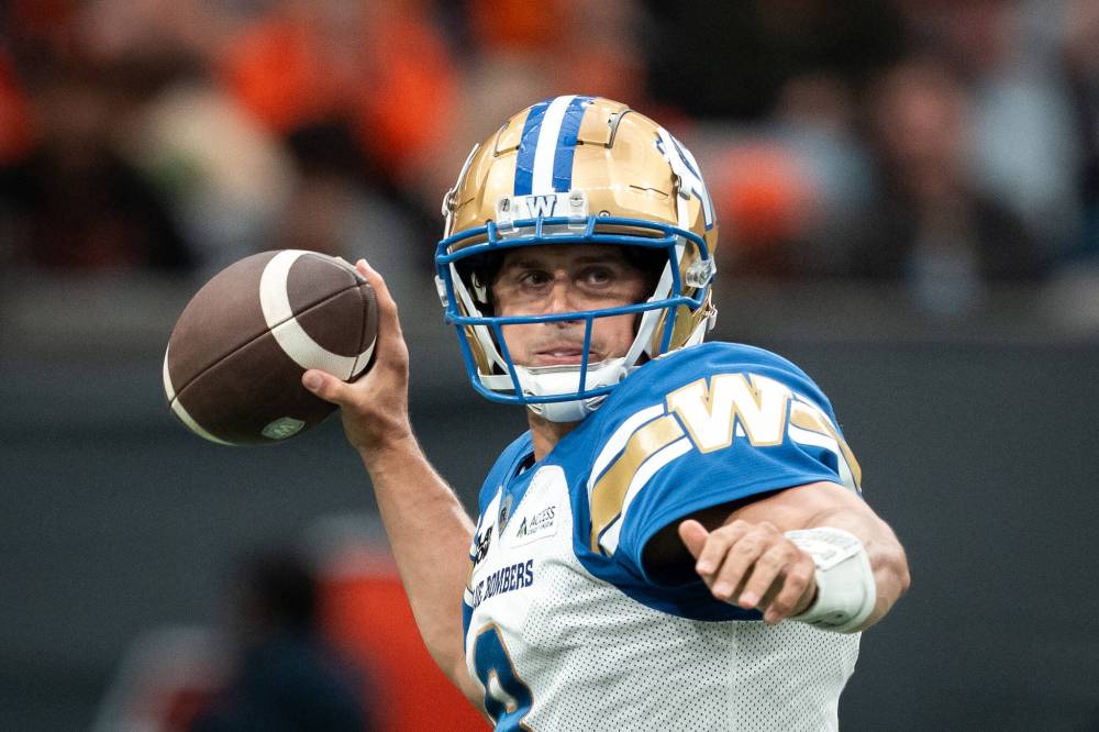 ETHAN CAIRNS / THE CANADIAN PRESS
Winnipeg Blue Bombers quarterback Zach Collaros (8) prepares to pass the ball during the first half of a CFL football game against the BC Lions in Vancouver, on Saturday, June 21, 2025.